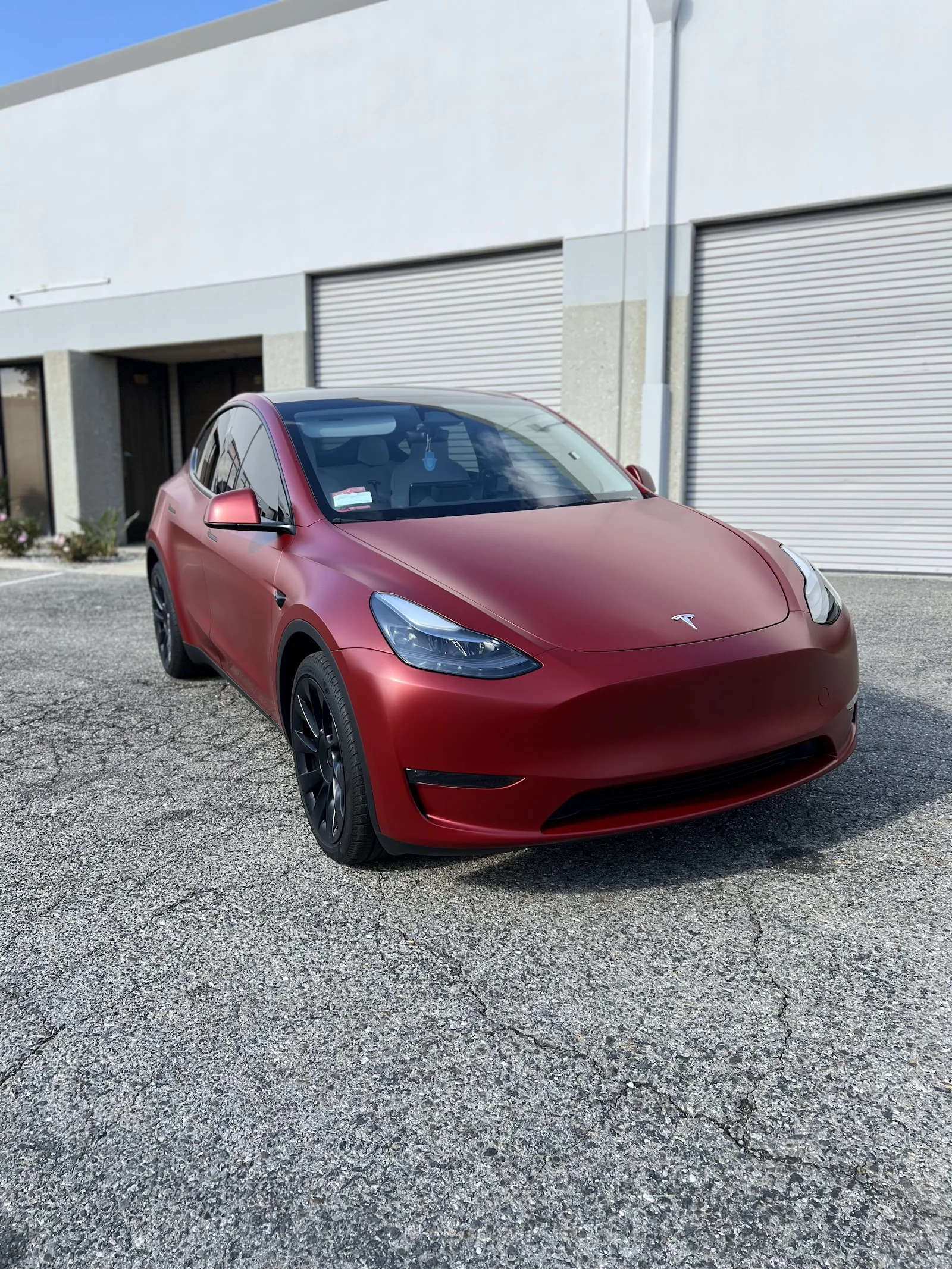 Matte red wrap on Tesla Model Y by NextGen Autostyling